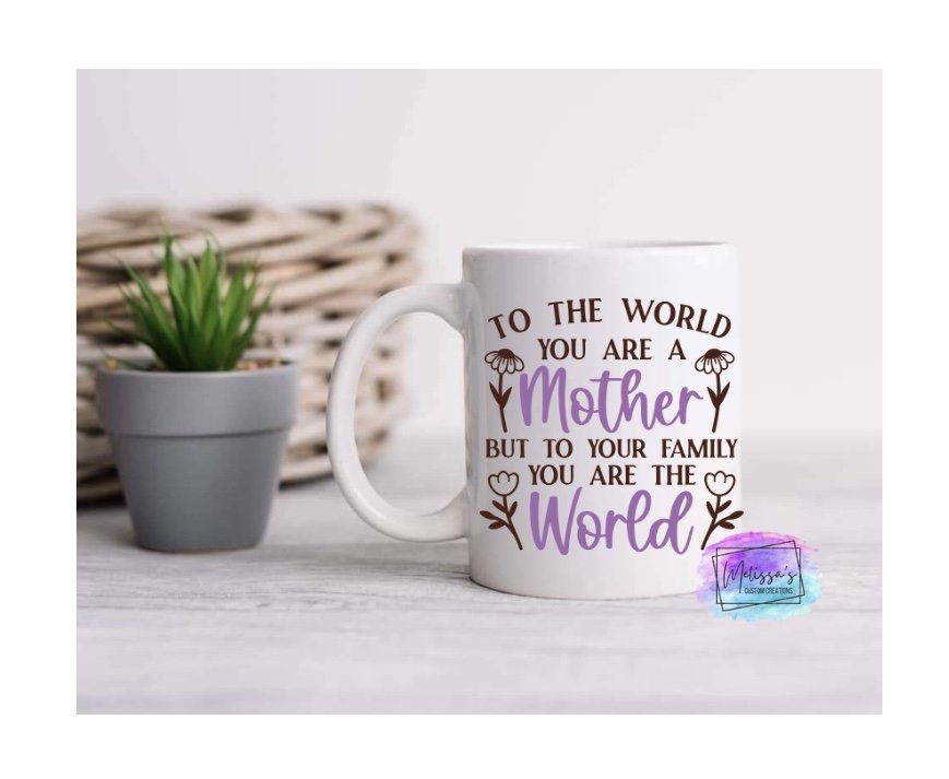 To The World You Are A Mother, But To Your Family You Are The World Mug