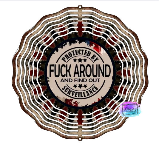 Protected By F*uck Around and Find Out Surveillance Wind Spinner